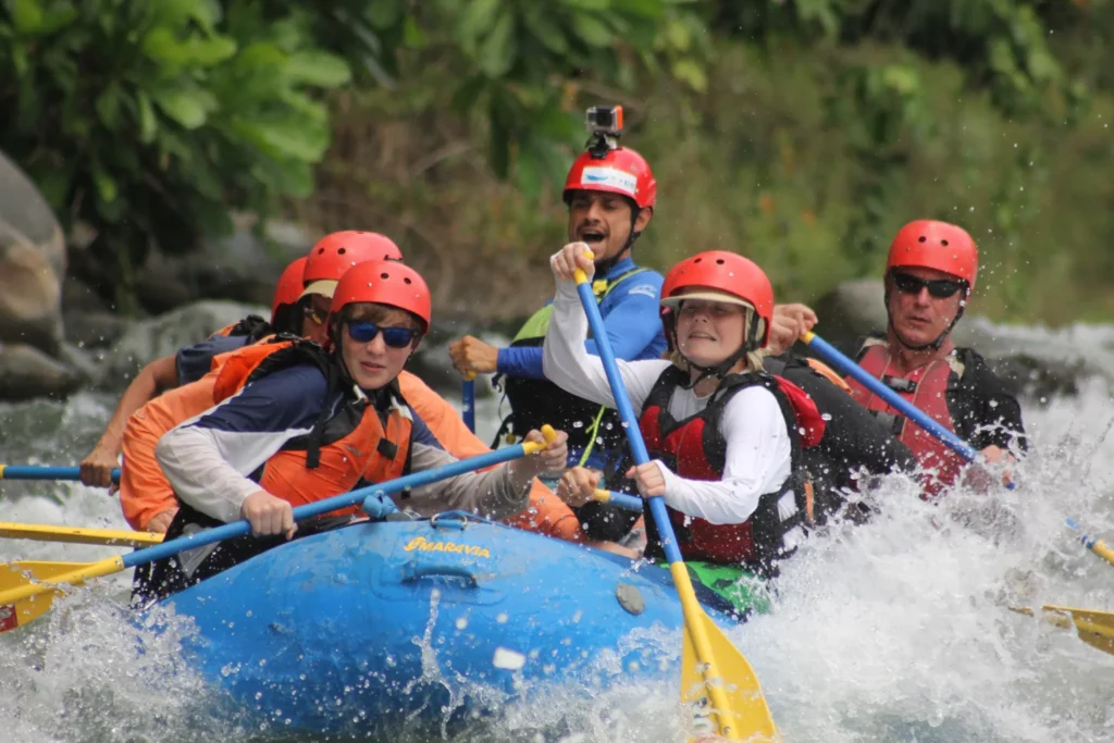 Exciting white-water rafting adventure in Costa Rica with crstours, featuring a group navigating through rapids with enthusiasm.